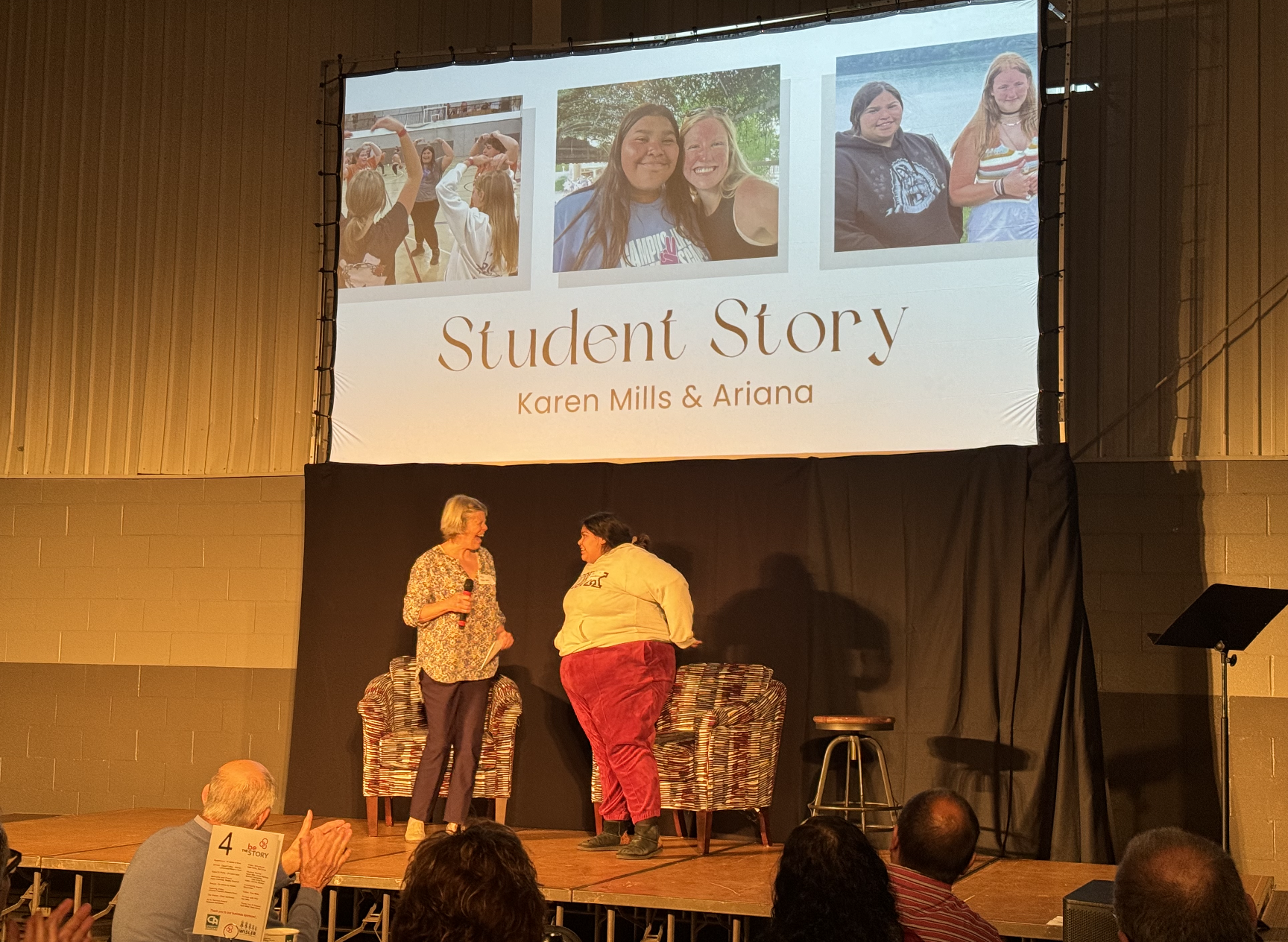 Karen with Ariana sharing her story at dinner 2023